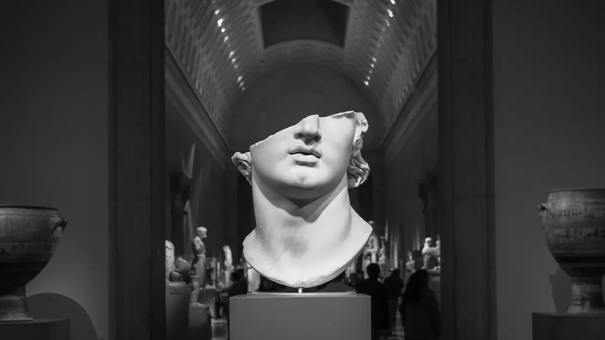 A broken marble head, missing its upper face, on display at the Metropolitan Museum of Art in New York